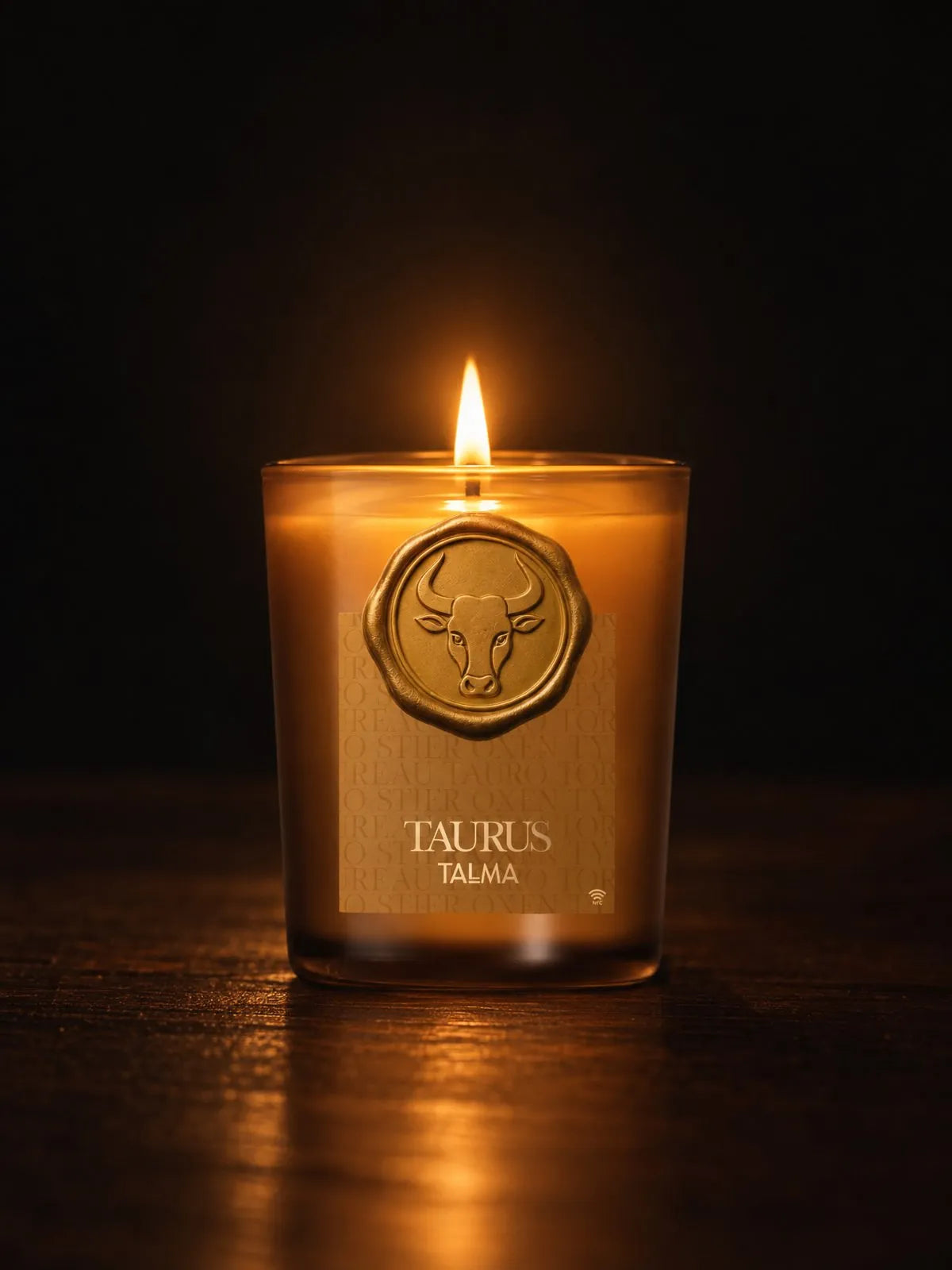 The Taurus candle lit in the night, amber glass